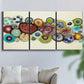 Three-panel canvas wall art featuring mid century geometric red pathway, displayed in a living room above a sofa.