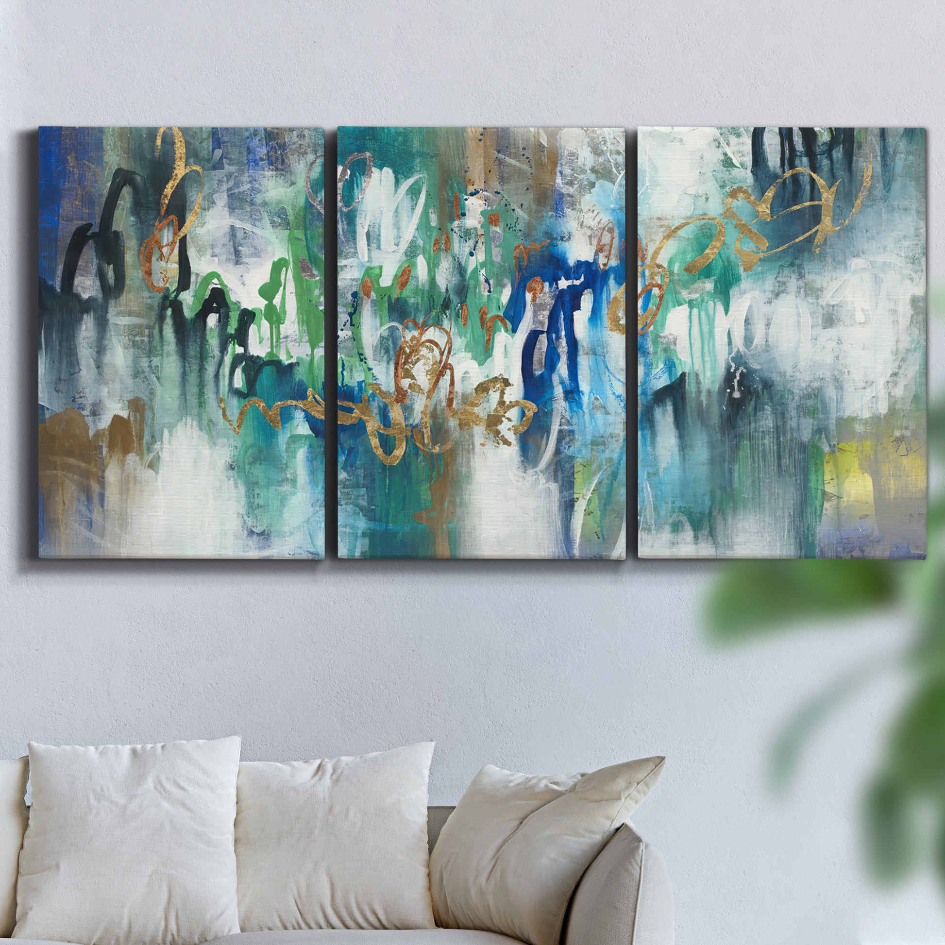 Three-panel canvas wall art featuring joyful abstract color harmony, displayed in a living room above a sofa.