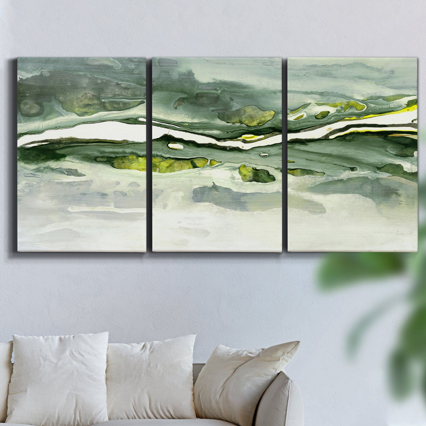 Three-panel canvas wall art featuring abstract passage of time composition, displayed in a living room above a sofa.