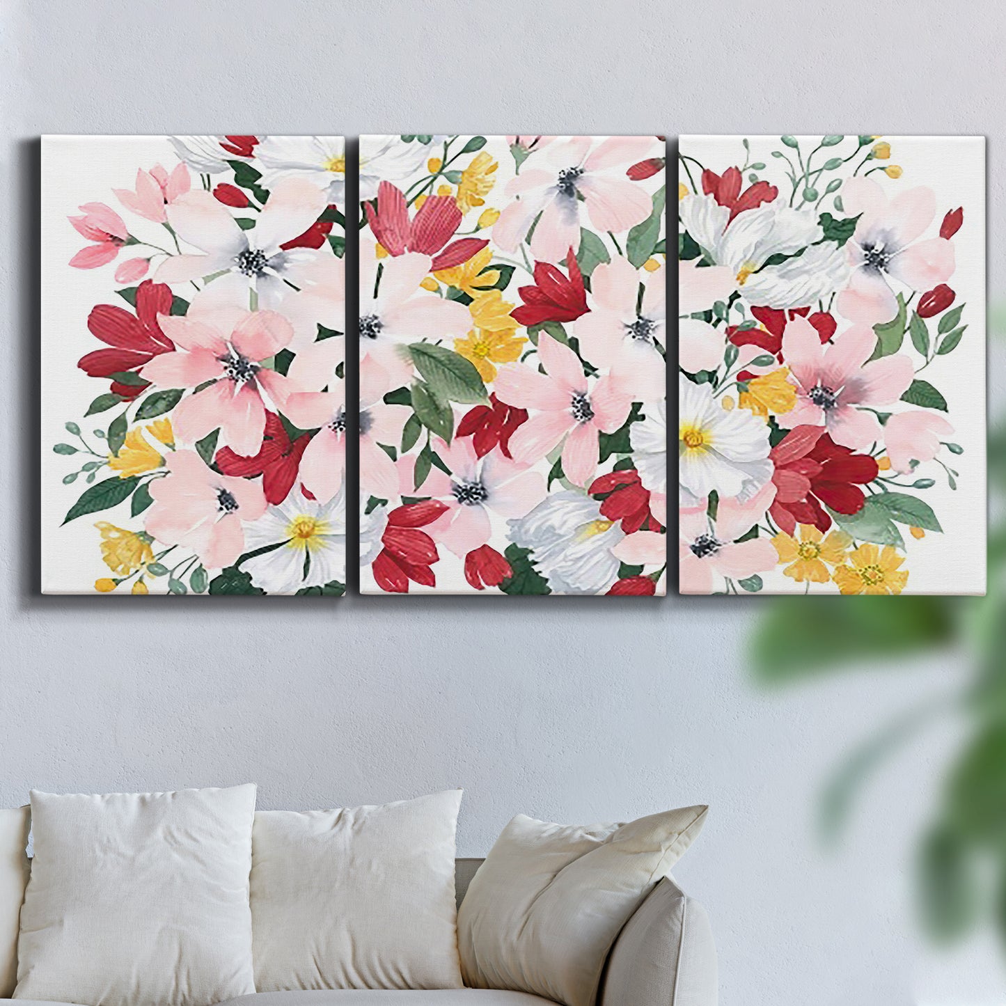 Three-panel canvas wall art featuring joyful spring floral composition, displayed in a living room above a sofa.