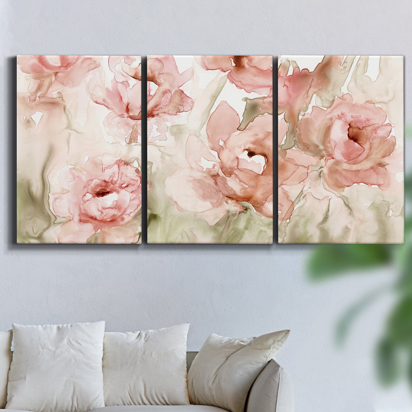 Three-panel canvas wall art featuring spring floral blossoms in bloom, displayed in a living room above a sofa.
