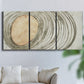 Three-panel canvas wall art featuring circular abstract energy forms, displayed in a living room above a sofa.