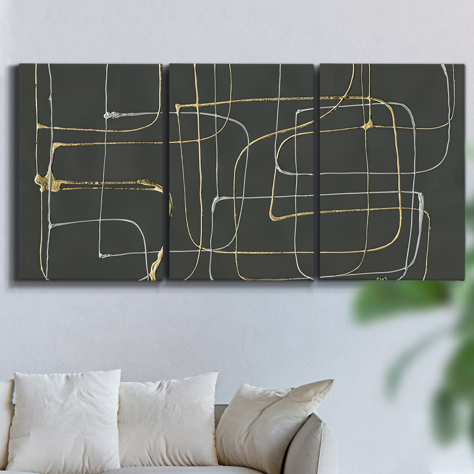 Three-panel canvas wall art featuring linear abstract conduit pattern, displayed in a living room above a sofa.