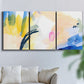 Three-panel canvas wall art featuring bright abstract candy colored strokes, displayed in a living room above a sofa.