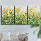 Three-panel canvas wall art featuring colorful garden flowers in bloom, displayed in a living room above a sofa.