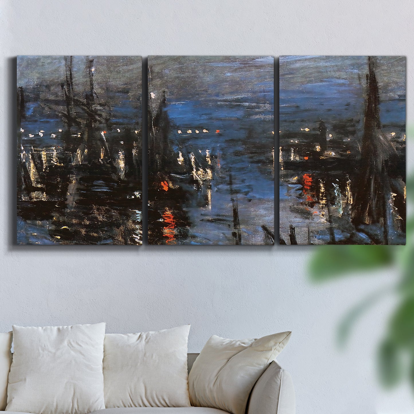 Three-panel canvas wall art featuring Le Havre port at night with lights, displayed in a living room above a sofa.