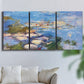 Three-panel canvas wall art featuring water lilies in blue and gold, displayed in a living room above a sofa.