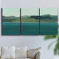 Three-panel canvas wall art featuring calm lake water under open sky, displayed in a living room above a sofa.