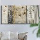 Three-panel canvas wall art featuring abstract willow inspired vertical forms, displayed in a living room above a sofa.