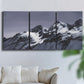 Three-panel canvas wall art featuring moonlit mountain peaks under night sky, displayed in a living room above a sofa.