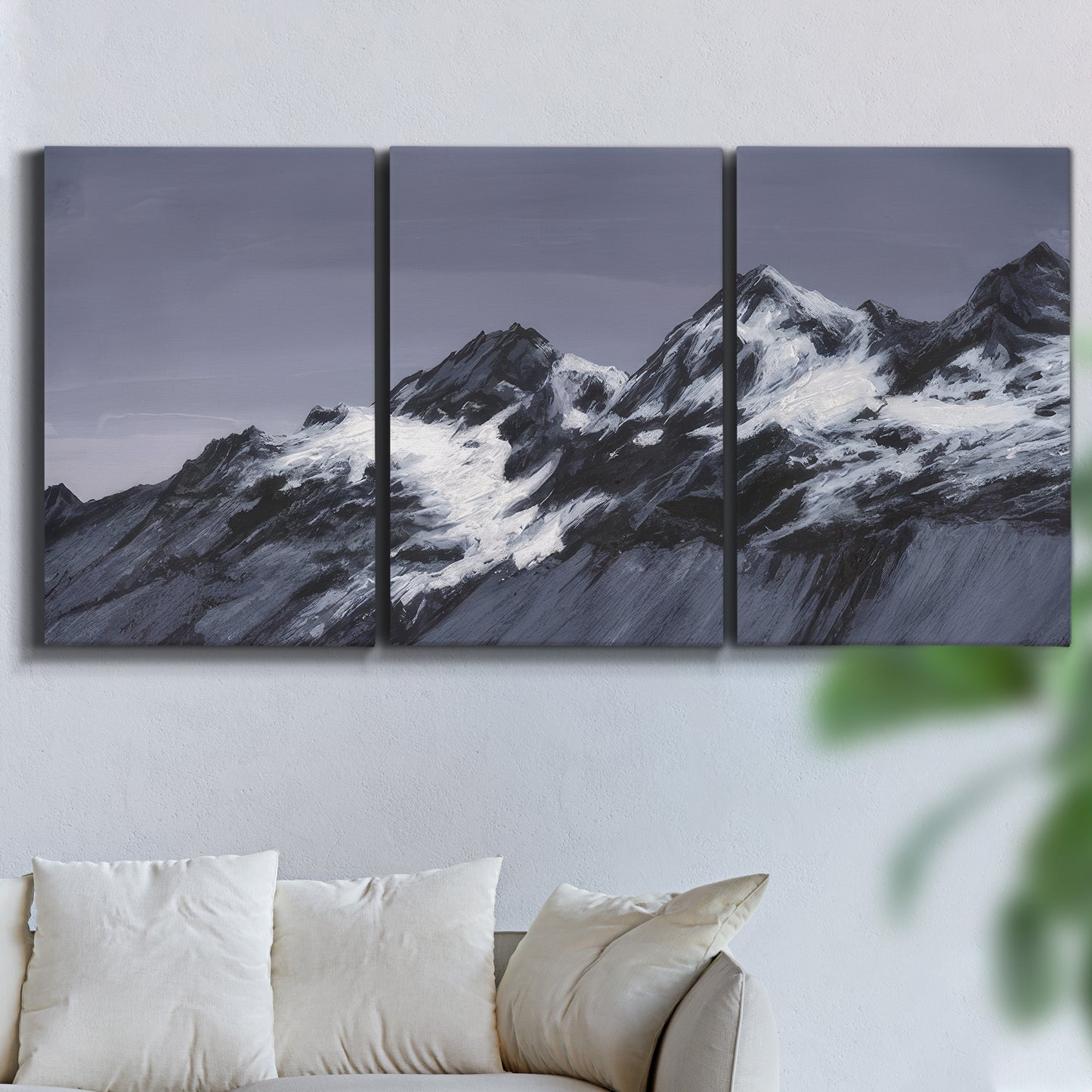 Three-panel canvas wall art featuring moonlit mountain peaks under night sky, displayed in a living room above a sofa.