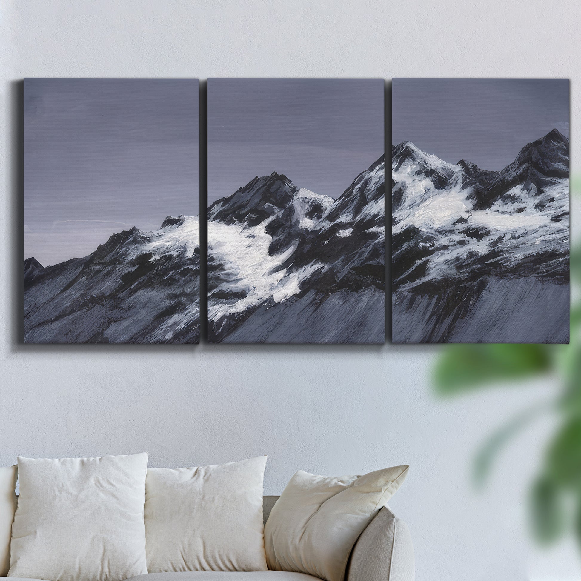 Three-panel canvas wall art featuring moonlit mountain peaks under night sky, displayed in a living room above a sofa.