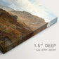 Canvas art print of a rugged mountain terrain with valley and distant peaks under open sky, highlighting texture and gallery-wrapped edges