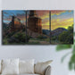 Three-panel canvas wall art featuring dramatic canyon landscape at dusk, displayed in a living room above a sofa.