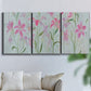 Three-panel canvas wall art featuring pink floral trio arrangement, displayed in a living room above a sofa.