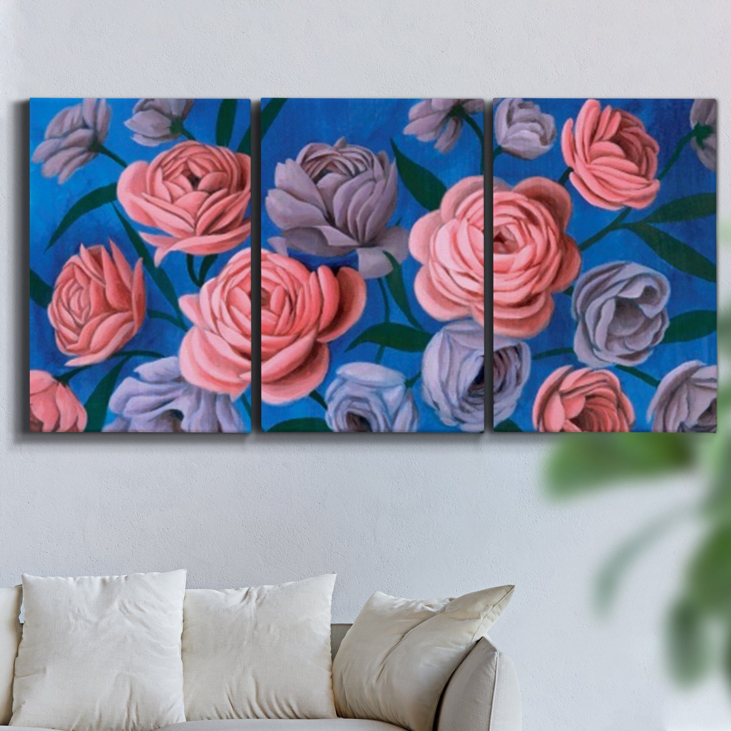 Three-panel canvas wall art featuring layered botanical petal abstractions, displayed in a living room above a sofa.