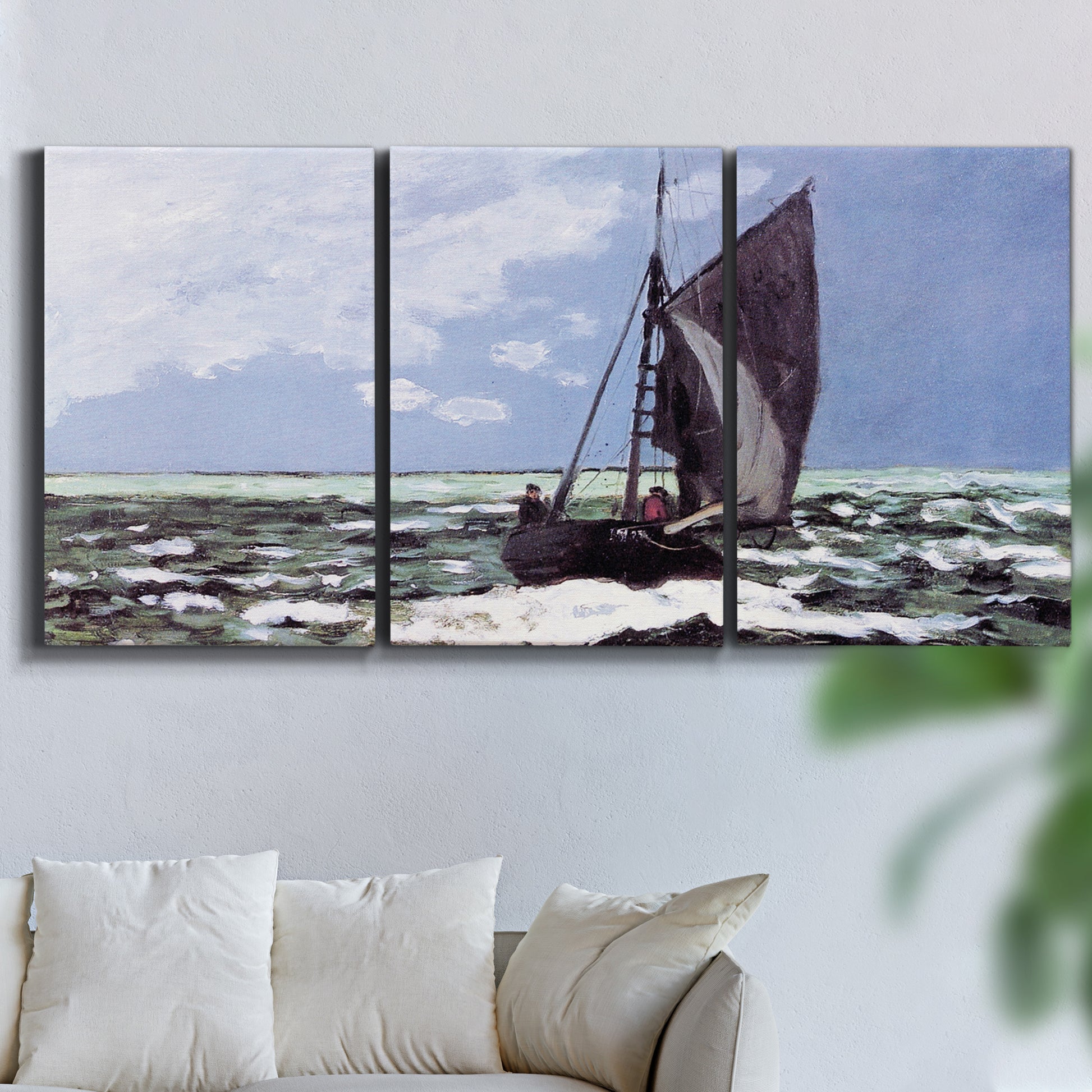Three-panel canvas wall art featuring stormy sea with crashing waves, displayed in a living room above a sofa.