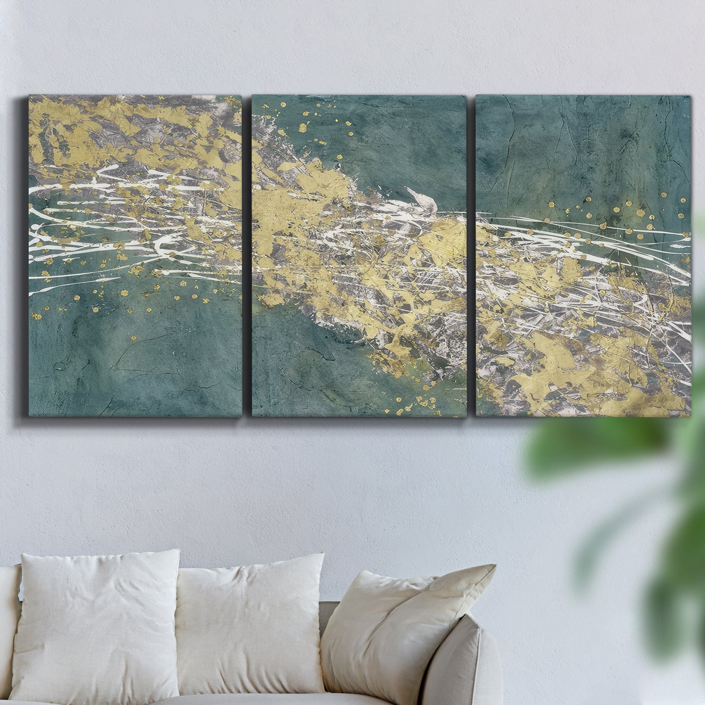 Three-panel canvas wall art featuring soft abstract wind movement, displayed in a living room above a sofa.