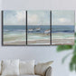 Three-panel canvas wall art featuring shore birds searching along beach, displayed in a living room above a sofa.