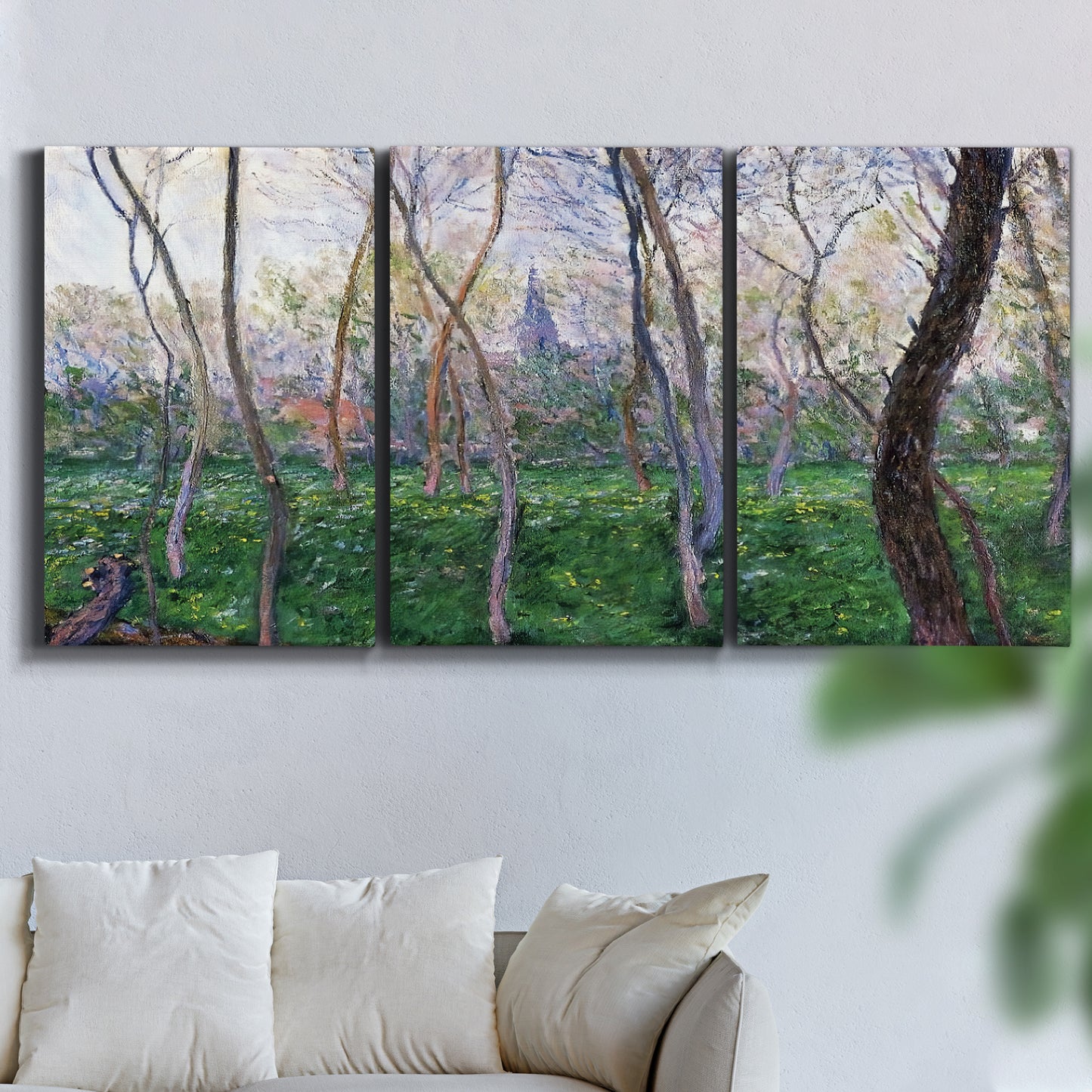 Three-panel canvas wall art featuring spring landscape along river, displayed in a living room above a sofa.
