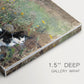 Canvas art print of a cat crouching in a meadow filled with wildflowers and greenery, highlighting texture and gallery-wrapped edges