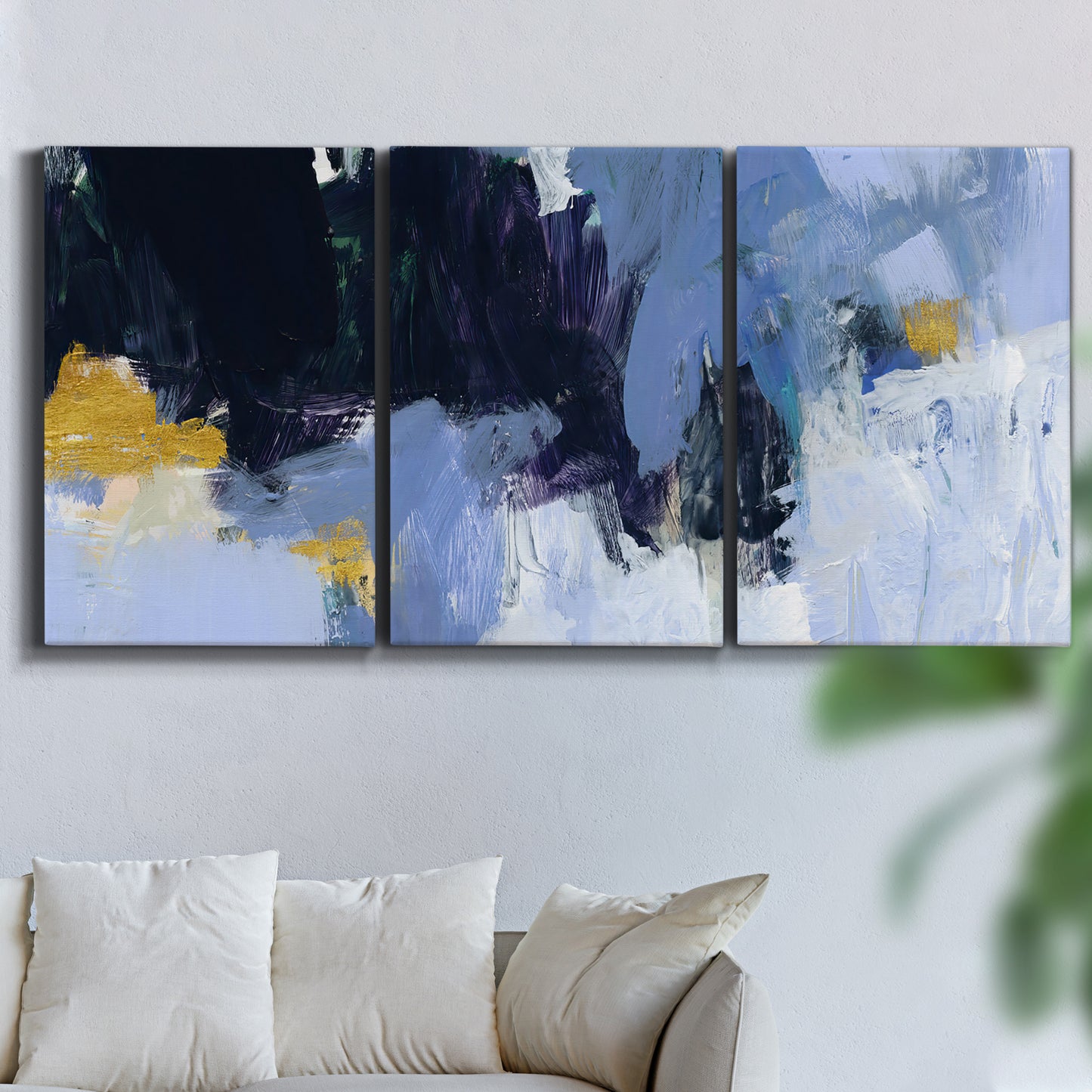 Three-panel canvas wall art featuring icy abstract arctic ledge, displayed in a living room above a sofa.