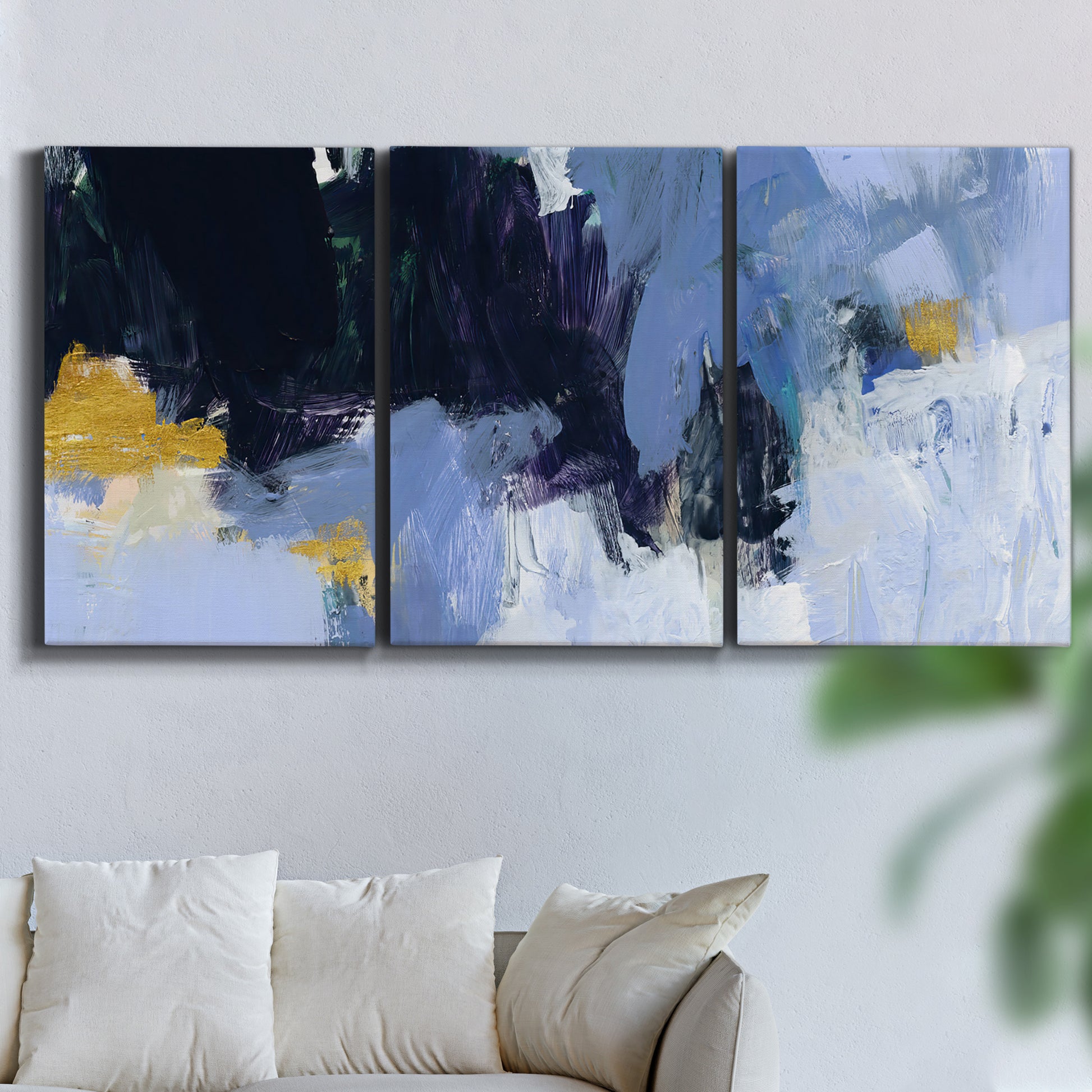 Three-panel canvas wall art featuring icy abstract arctic ledge, displayed in a living room above a sofa.