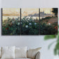 Three-panel canvas wall art featuring formal garden near museum grounds, displayed in a living room above a sofa.