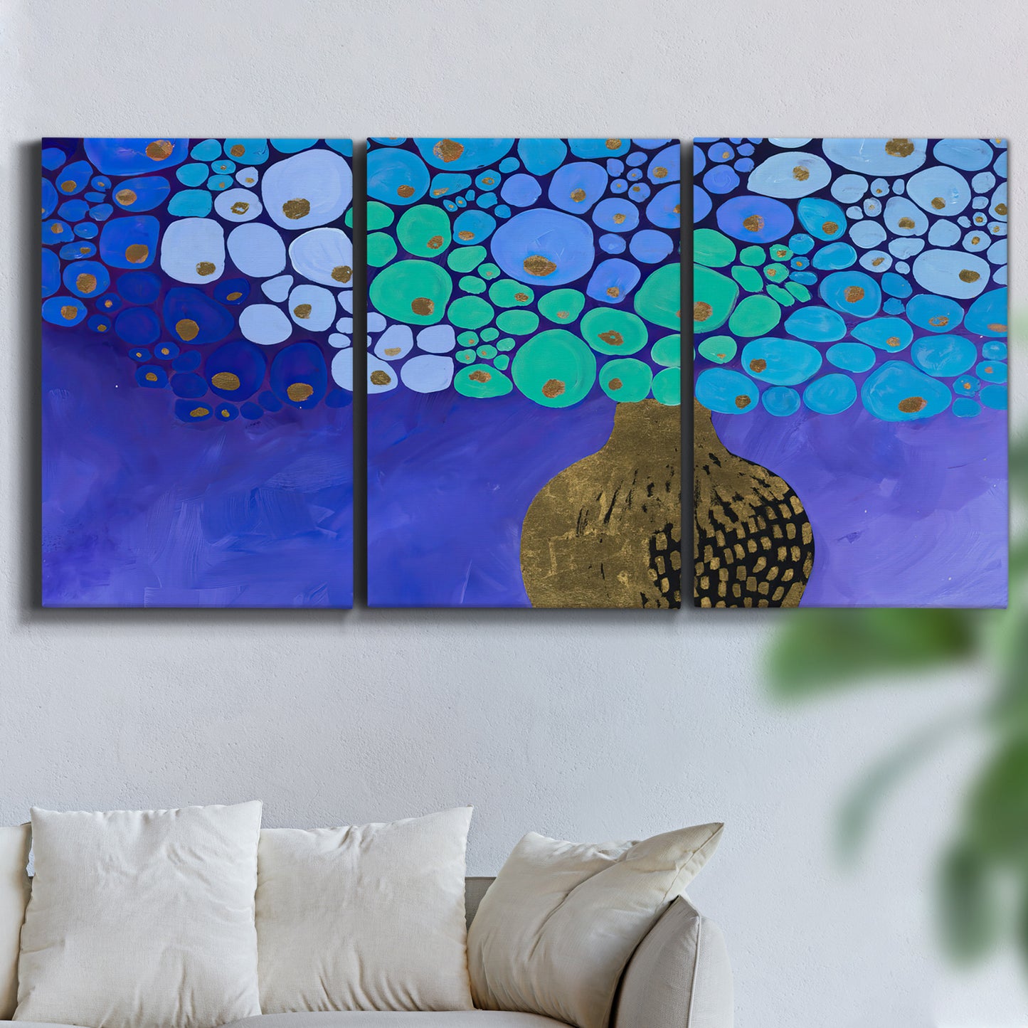 Three-panel canvas wall art featuring blue poppy floral abstraction, displayed in a living room above a sofa.