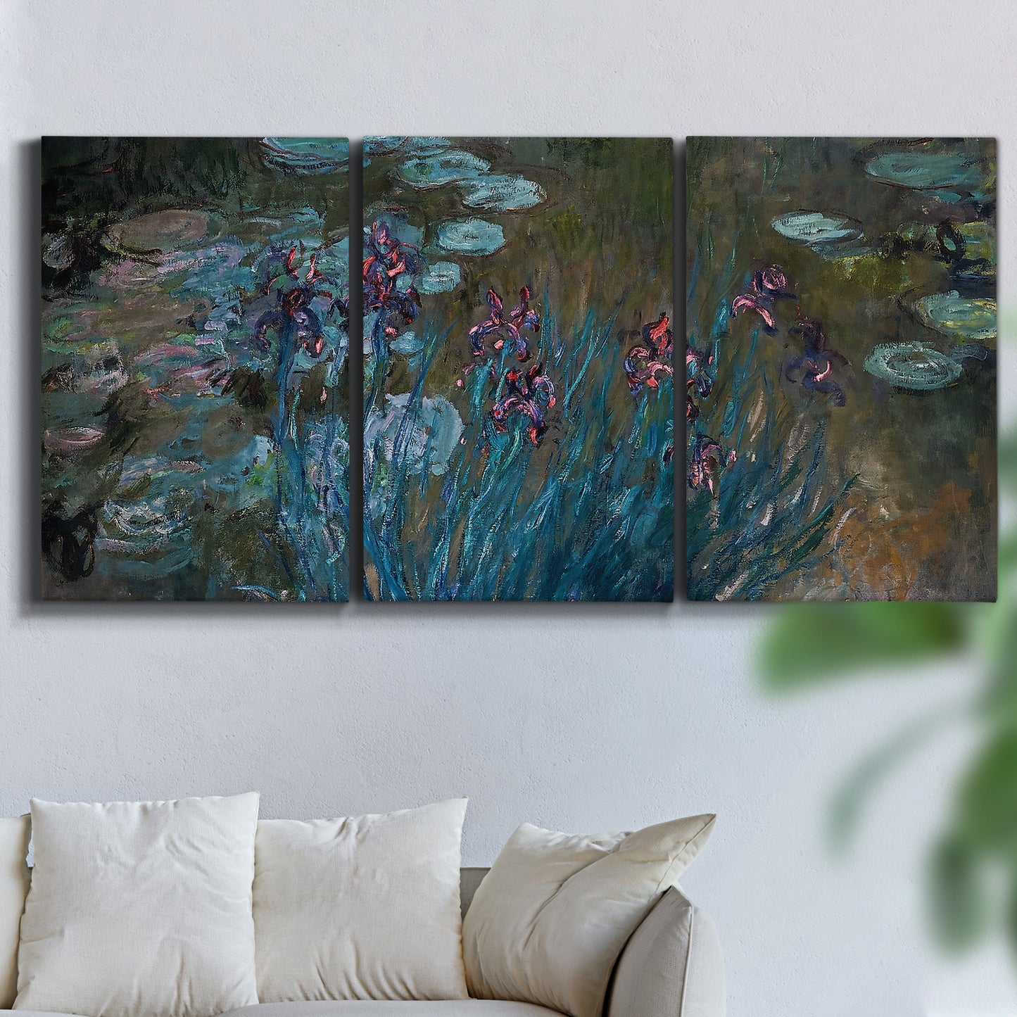 Three-panel canvas wall art featuring water lilies on reflective pond, displayed in a living room above a sofa.