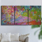 Three-panel canvas wall art featuring vibrant abstract with dramatic motion, displayed in a living room above a sofa.