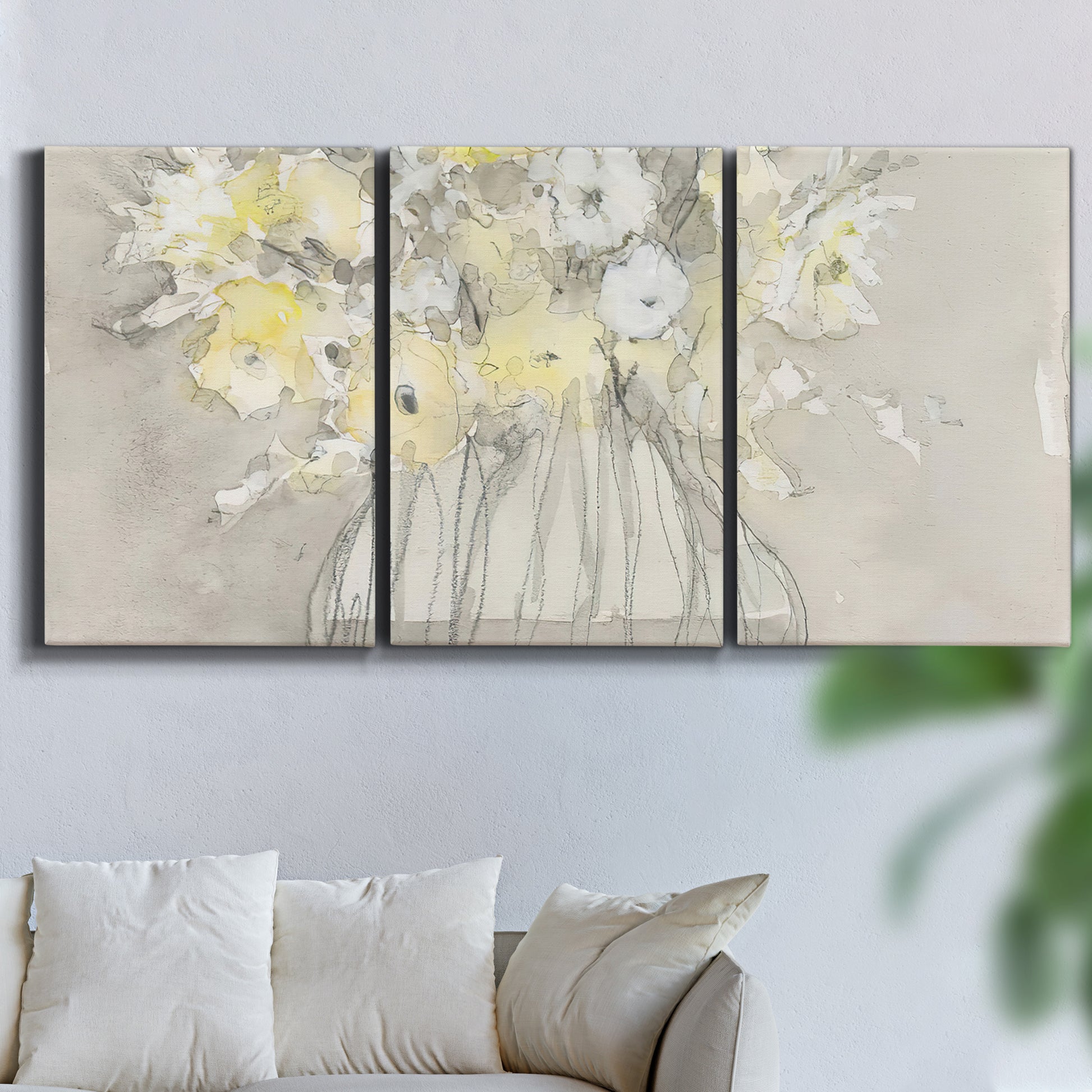 Three-panel canvas wall art featuring vintage floral abstract composition, displayed in a living room above a sofa.