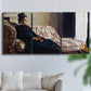 Three-panel canvas wall art featuring woman resting on sofa indoors, displayed in a living room above a sofa.