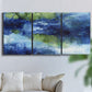 Three-panel canvas wall art featuring flowing blue abstract watercolor, displayed in a living room above a sofa.