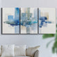 Three-panel canvas wall art featuring minimal urban skyline watercolor, displayed in a living room above a sofa.