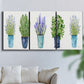 Three-panel canvas wall art featuring minimal monochrome abstract forms, displayed in a living room above a sofa.
