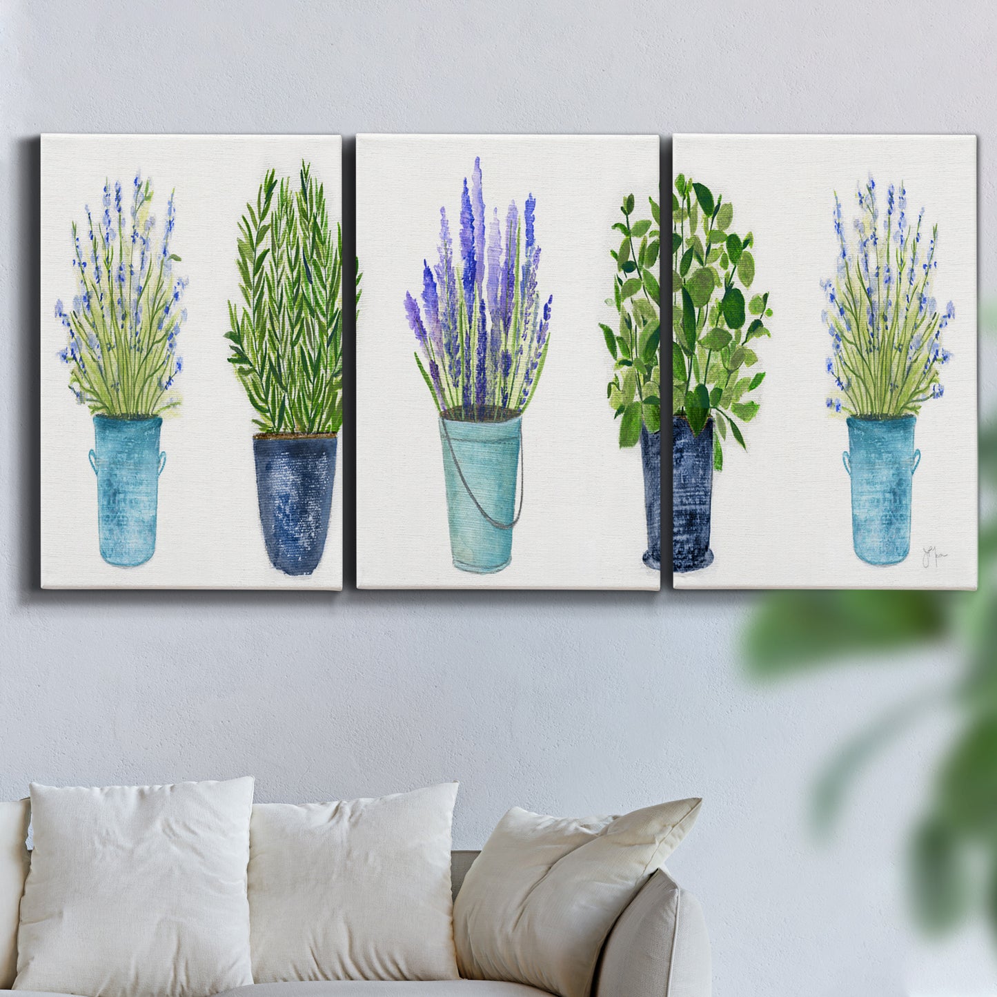 Three-panel canvas wall art featuring minimal monochrome abstract forms, displayed in a living room above a sofa.