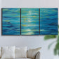 Three-panel canvas wall art featuring deep blue ocean water abstraction, displayed in a living room above a sofa.