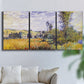 Three-panel canvas wall art featuring river village landscape with hills, displayed in a living room above a sofa.