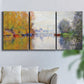 Three-panel canvas wall art featuring golden autumn light over riverside, displayed in a living room above a sofa.