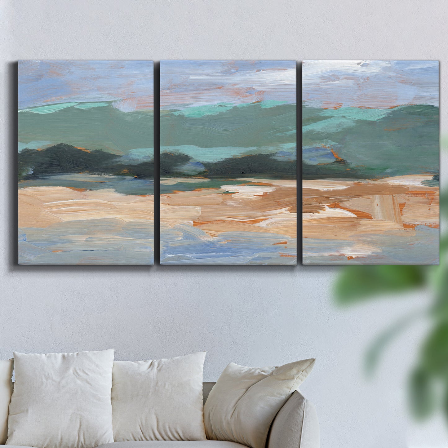 Three-panel canvas wall art featuring abstract landscape composition study, displayed in a living room above a sofa.