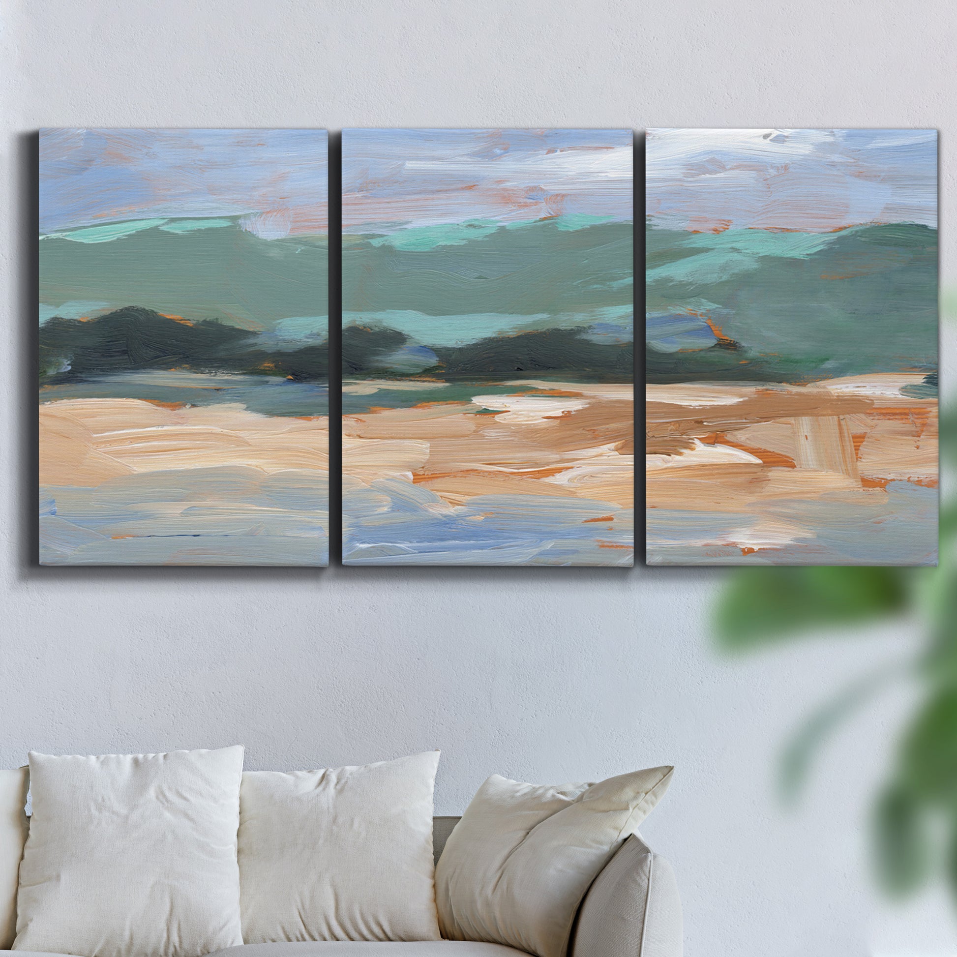 Three-panel canvas wall art featuring abstract landscape composition study, displayed in a living room above a sofa.