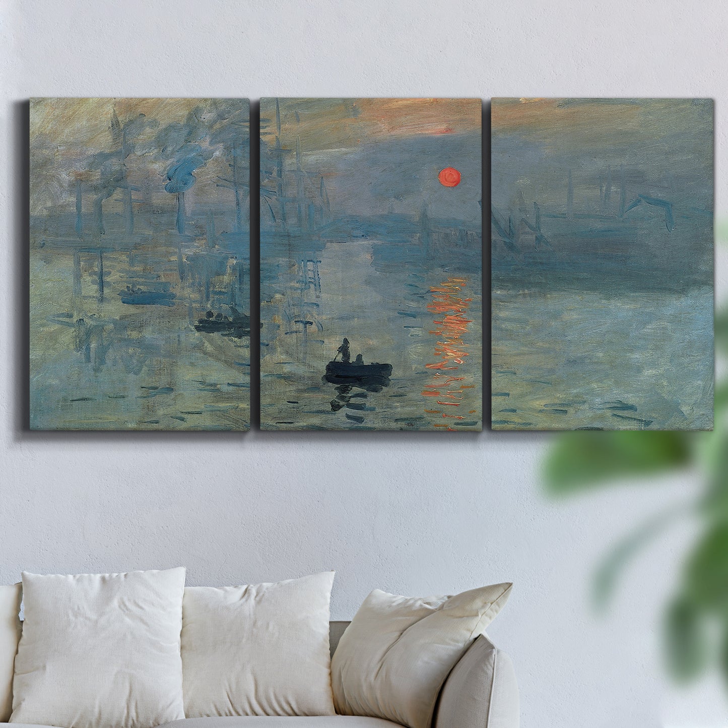 Three-panel canvas wall art featuring misty harbor sunrise with boats, displayed in a living room above a sofa.