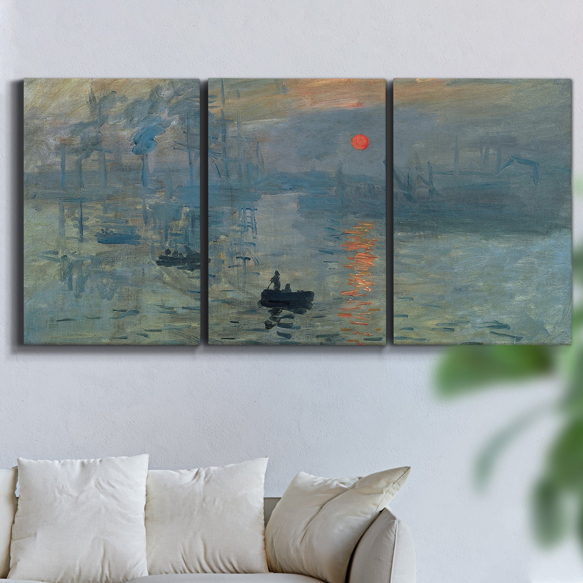 Three-panel canvas wall art featuring misty harbor sunrise with boats, displayed in a living room above a sofa.