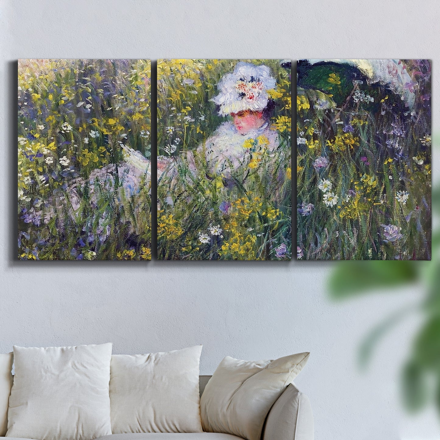 Three-panel canvas wall art featuring woman walking with parasol, displayed in a living room above a sofa.