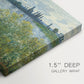 Canvas art print of a riverbank landscape with water, trees, and distant village buildings, highlighting texture and gallery-wrapped edges