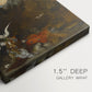 Close-up of a gallery-wrapped canvas corner showing a dramatic scene with a solitary figure and deep space, highlighting texture and print detail.