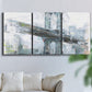 Three-panel canvas wall art featuring urban cityscape with architectural forms, displayed in a living room above a sofa.