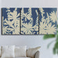 Three-panel canvas wall art featuring delicate lupine floral composition, displayed in a living room above a sofa.