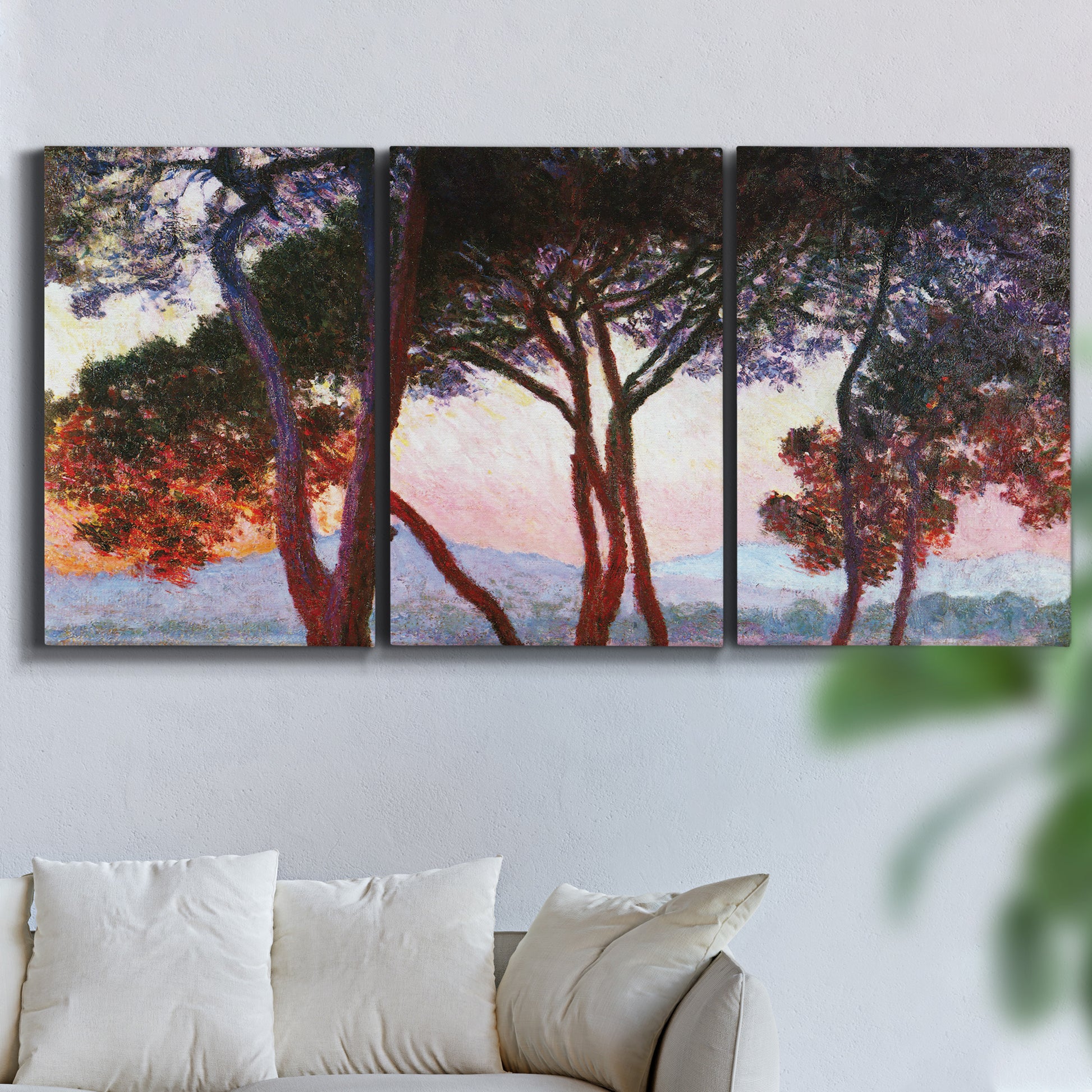 Three-panel canvas wall art featuring sunlit pines along mediterranean coast, displayed in a living room above a sofa.